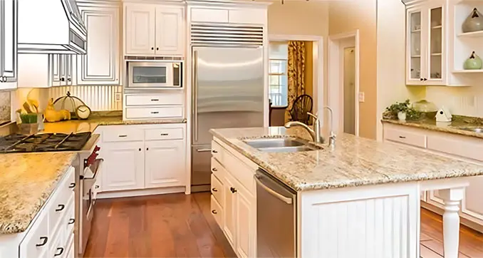 A kitchen with white cabinets and wood floors.